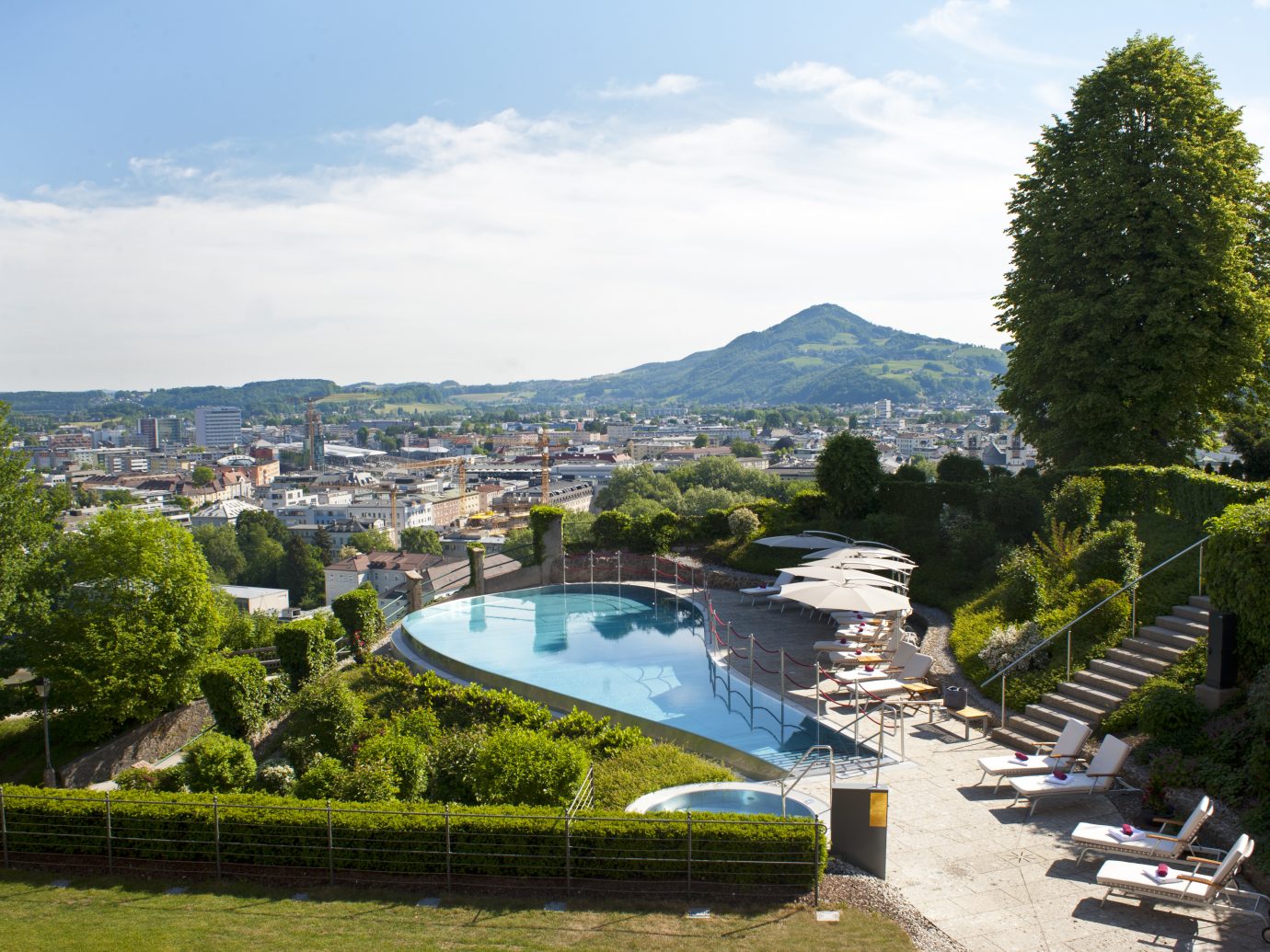 the grounds and pool at Schloss Mönchstein Hotel in Salzburg, Austria