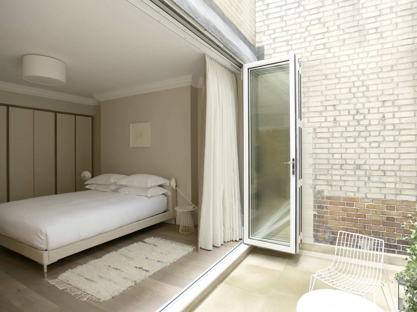 Bed open to outside at the Welbeck portion of the Living Rooms in London