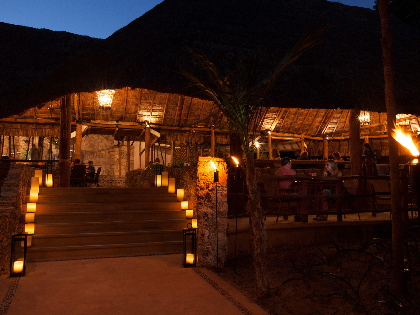 Night time eating lit with candles at Mahekal Beach Resort