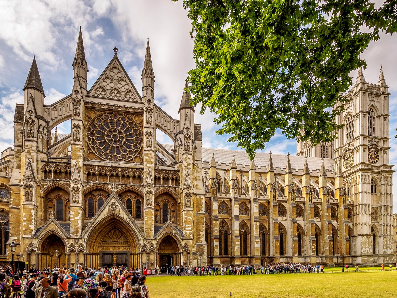 Multi-shop panorama of Westminster Abbey, London in high season;