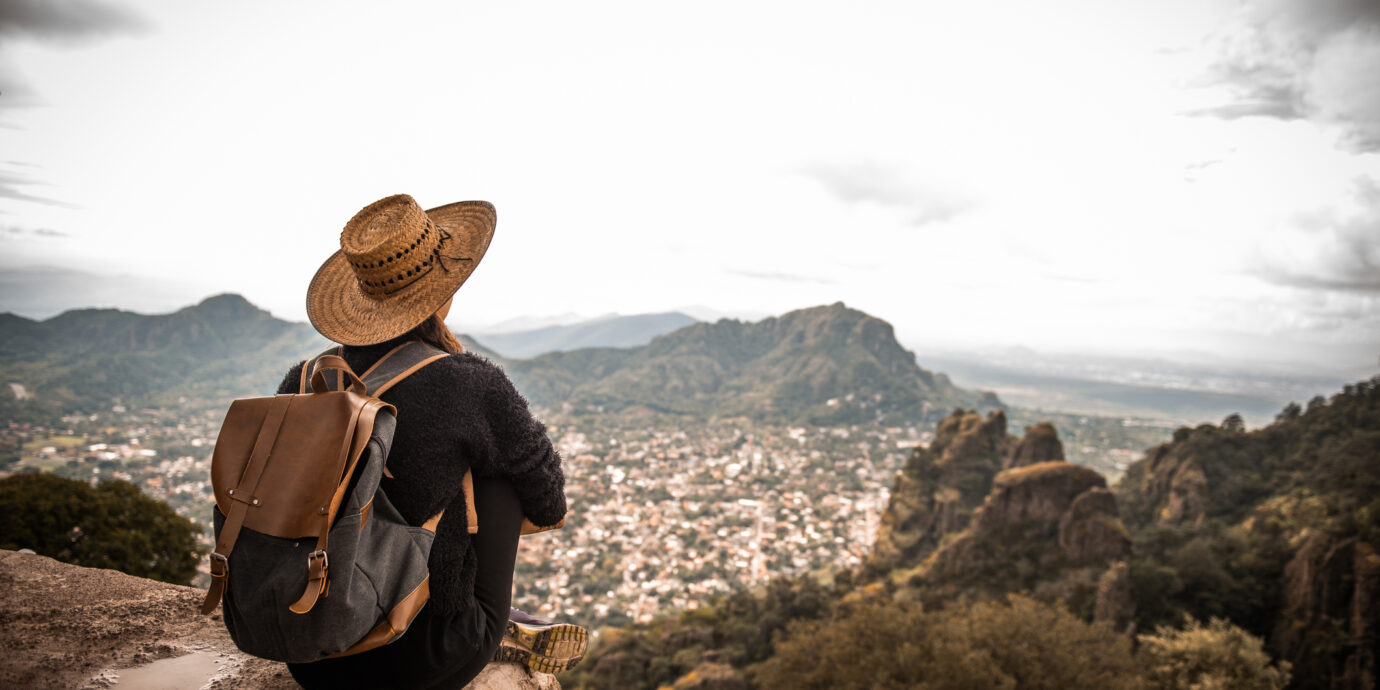 Woman traveling Mexico. She is enjoying the view on Tepoztlan, Mexico