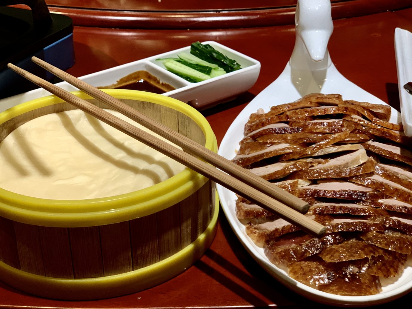 Beijing’s famed Peking Duck is sliced thin and served with rice pancakes, cucumber, onion and “peking” sauce.
