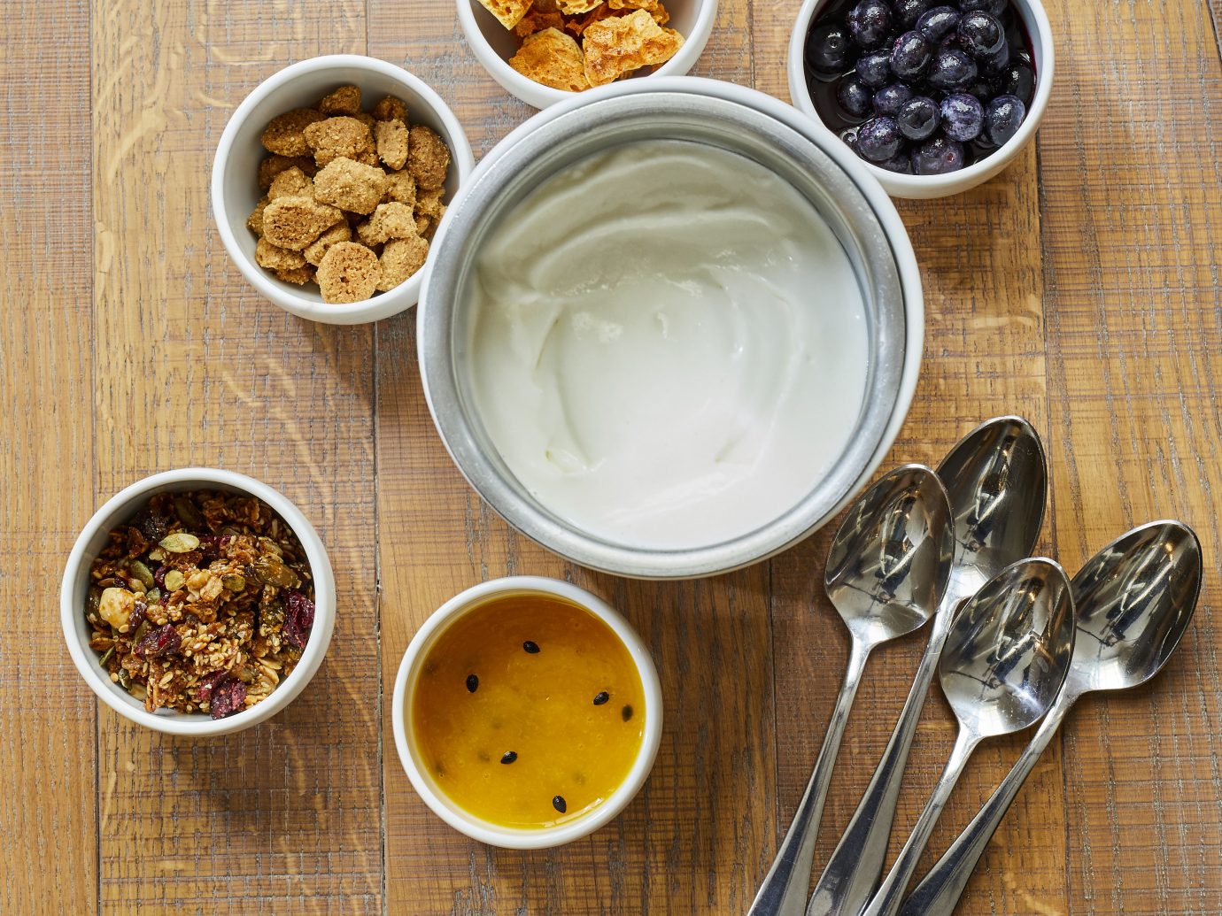 yogurt with numerous options in little bowls to put in it