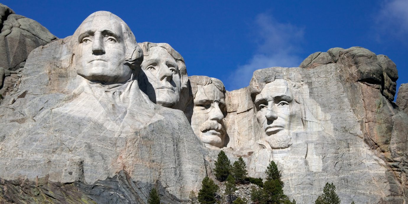 Best Presidents Day Sales 2019, Close up view of Mount Rushmore under a blue sky