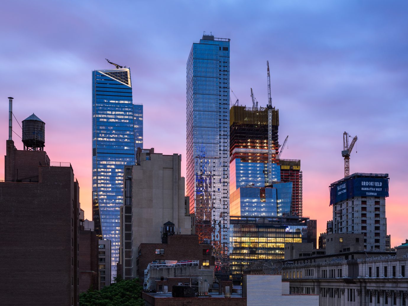 New York City, NY, USA - June 8, 2017: The Hudson Yards construction site with 30 Hudson Yards under construction, the completed 10 Hudson Yards and Eugene skyscrapers at sunset. Midtown, Manhattan