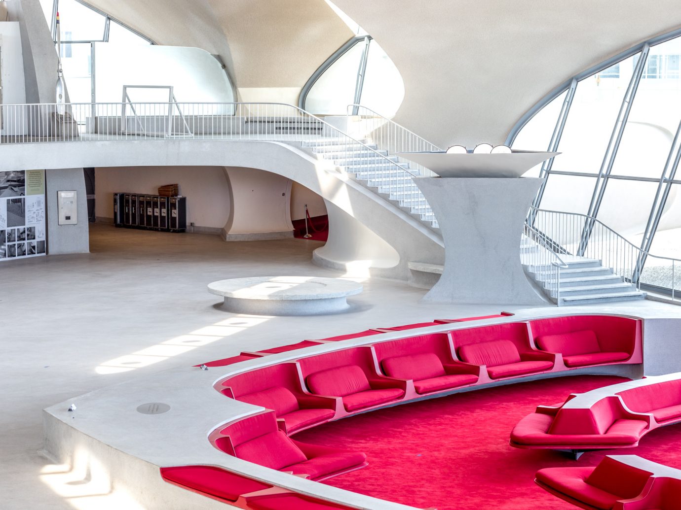 lobby with red seating in TWA Hotel