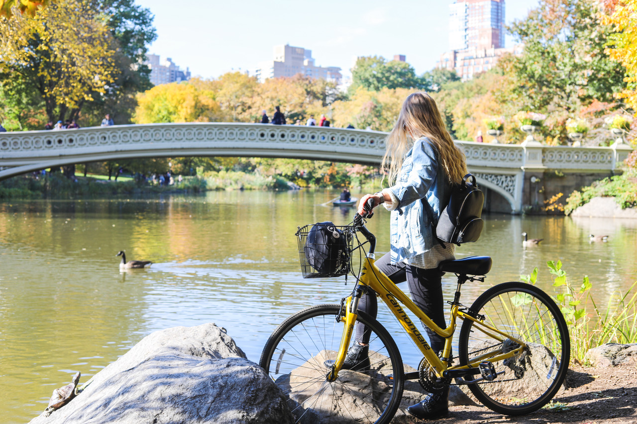 woman with a bike in central park