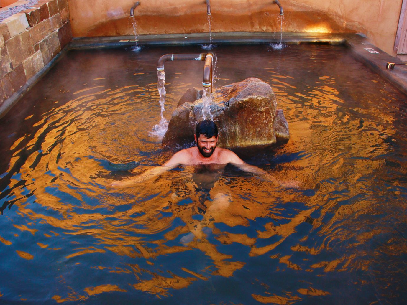 man in hot springs