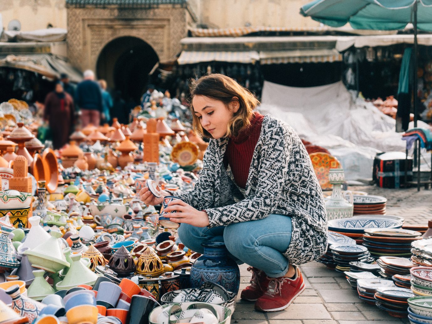 Young Caucasian woman choosing Ceramic in shop in Meknes, Morocco