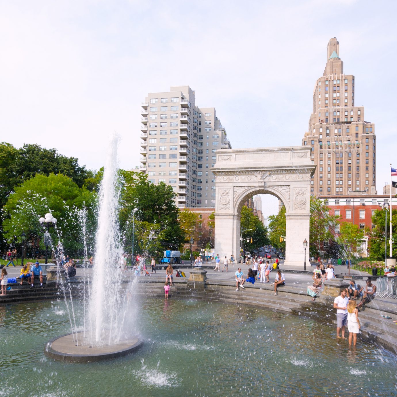 People meander about the fountain at Washington Square Park near the Washington Square Arch at Greenwich Village in the Manhattan borough of New York City.