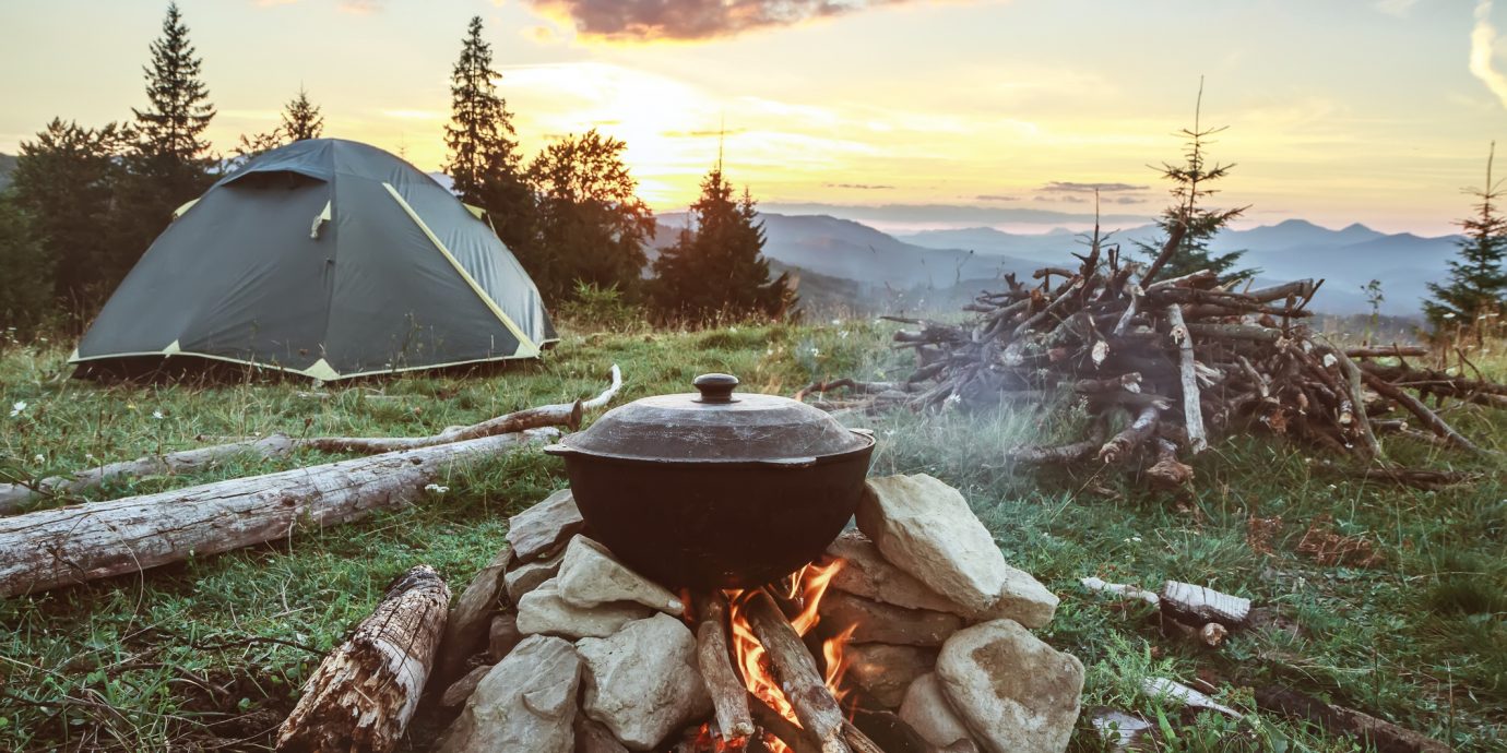 camping with fire, tent and firewood