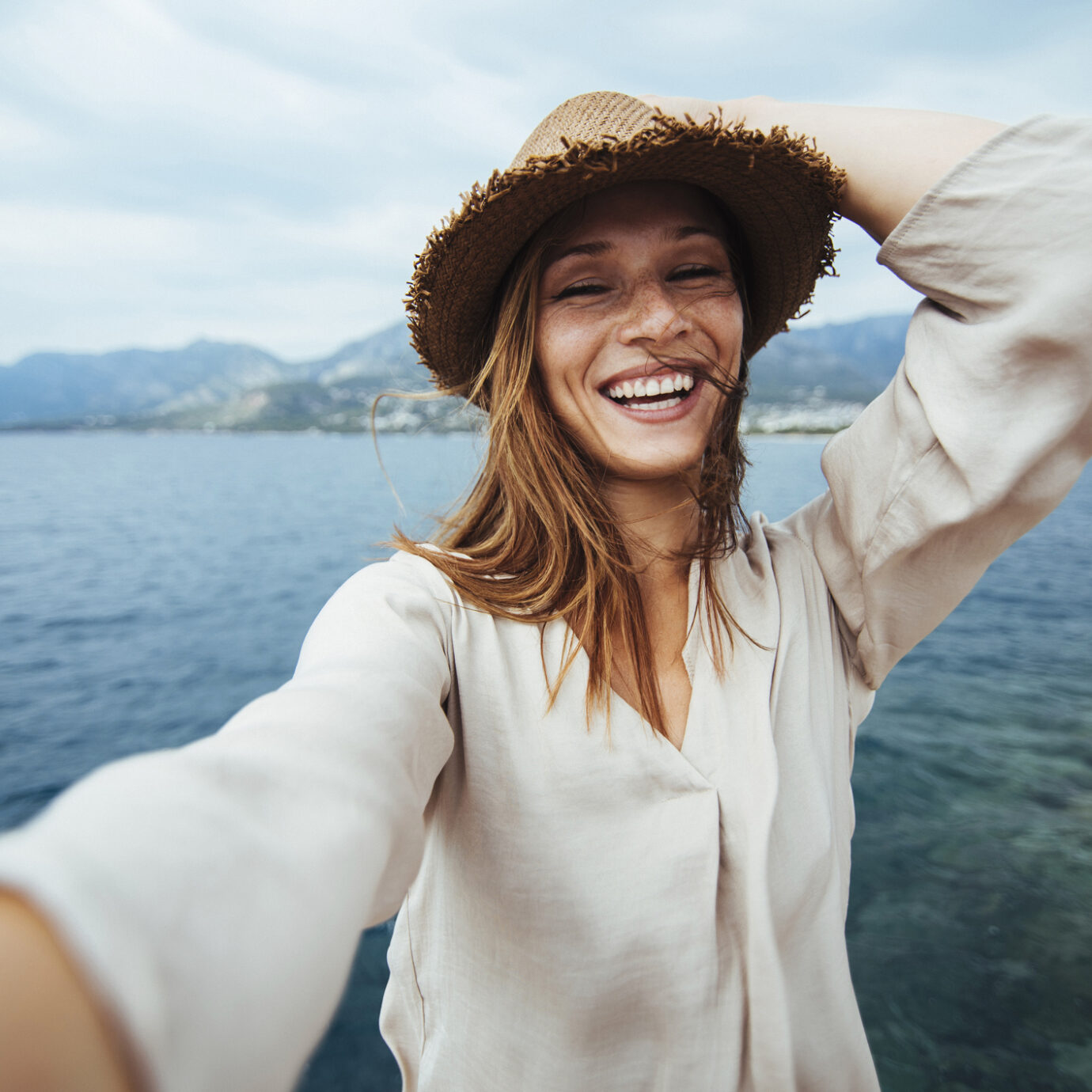 Young woman doing selfie on a vacation