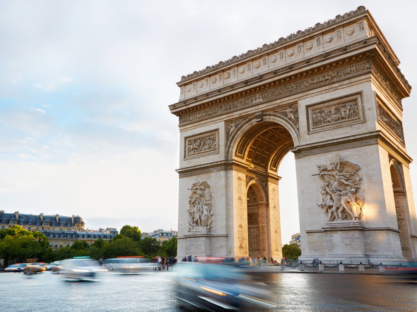 Arc de Triomphe in Paris, France. Traffic in the morning.