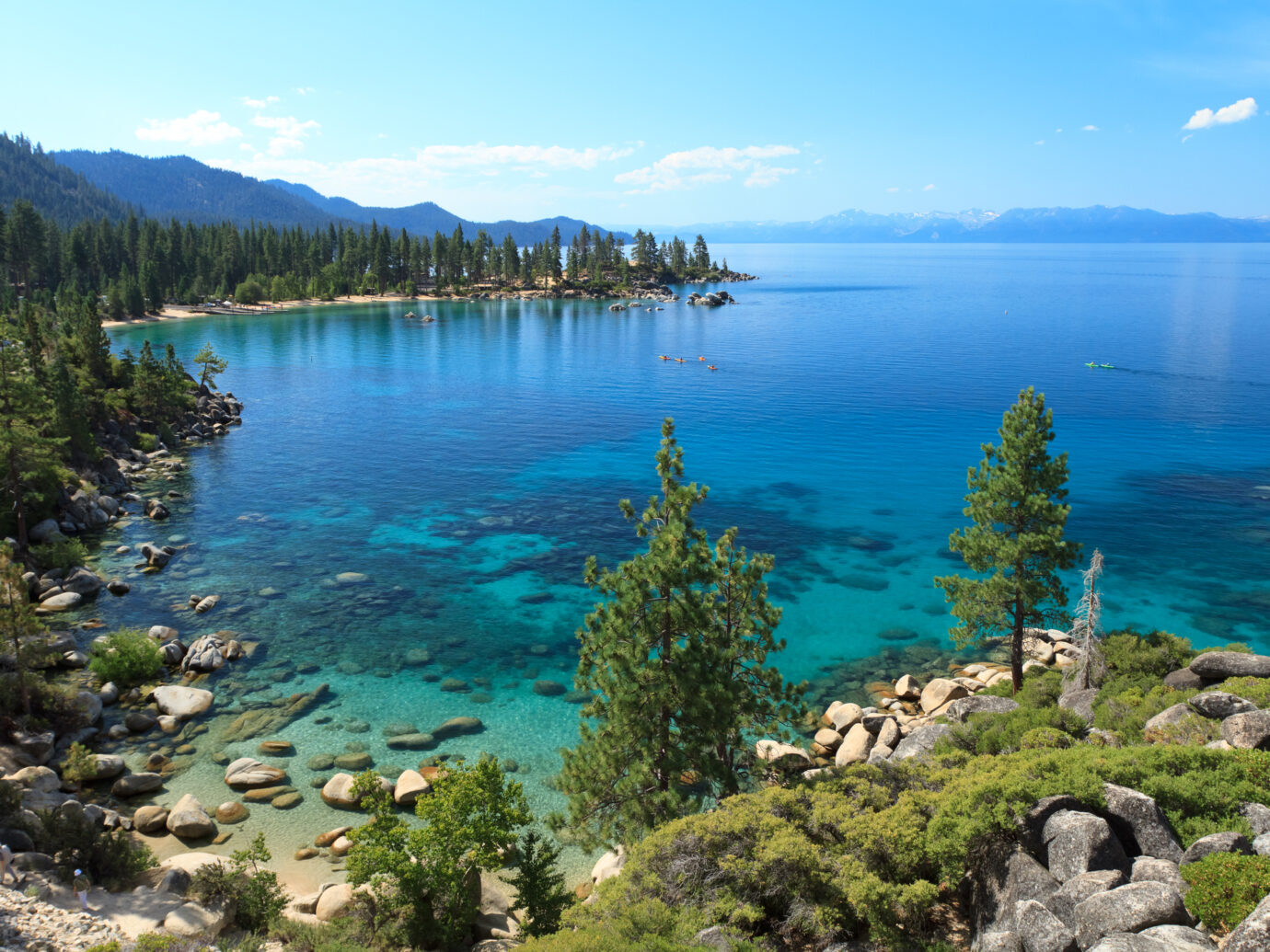 Picture of Lake Tahoe seeing from view point near Sand Harbor. This is east shore line with many rocks and pine trees photographed in the morning during summer.
