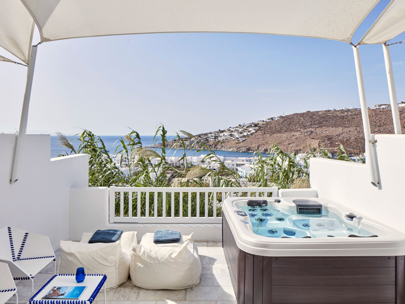outdoor hot tub and ocean view from Myconian Ambassador Hotel