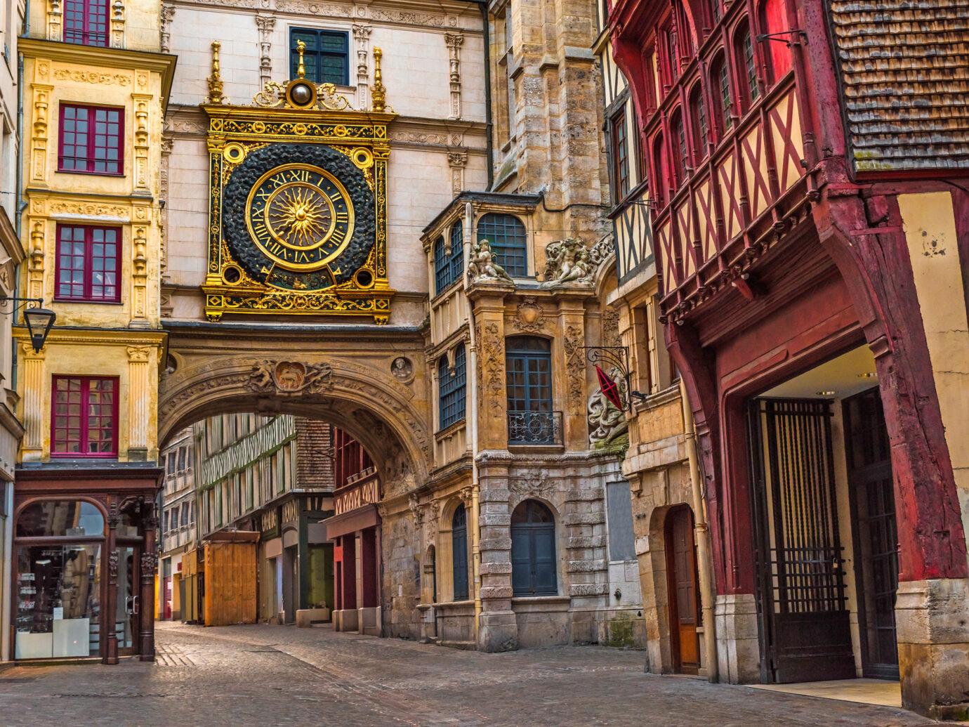 Old cozy street in Rouen with famos Great clocks or Gros Horloge of Rouen, Normandy, France with nobody