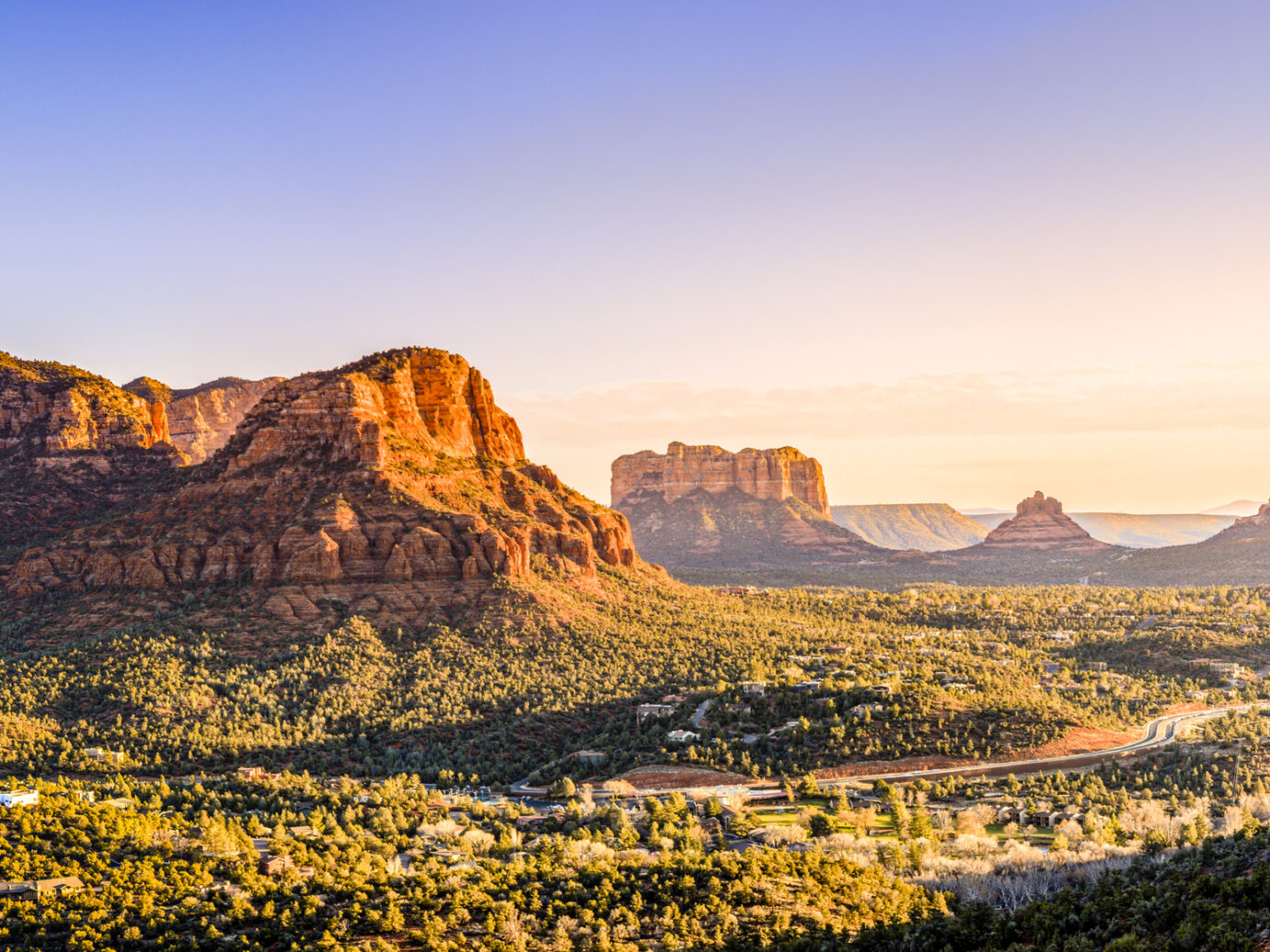 Scenic view to Courthouse Butte, Bell Rock and surrounding red rocks formations in Sedona, Arizona at sunset
