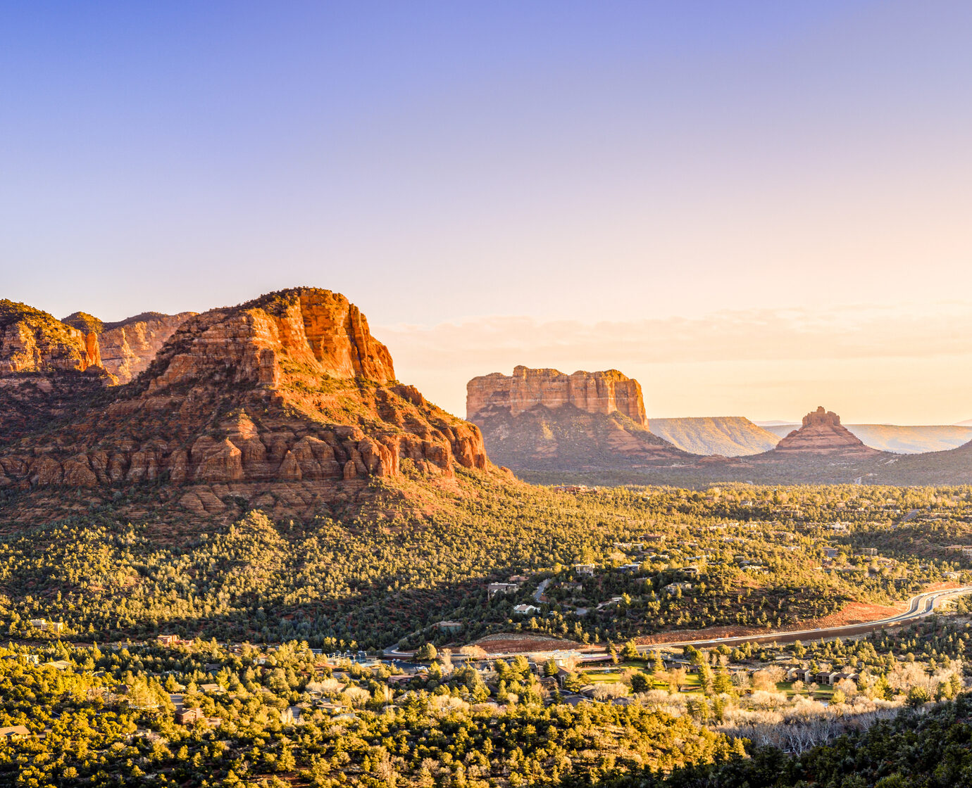 Scenic view to Courthouse Butte, Bell Rock and surrounding red rocks formations in Sedona, Arizona at sunset