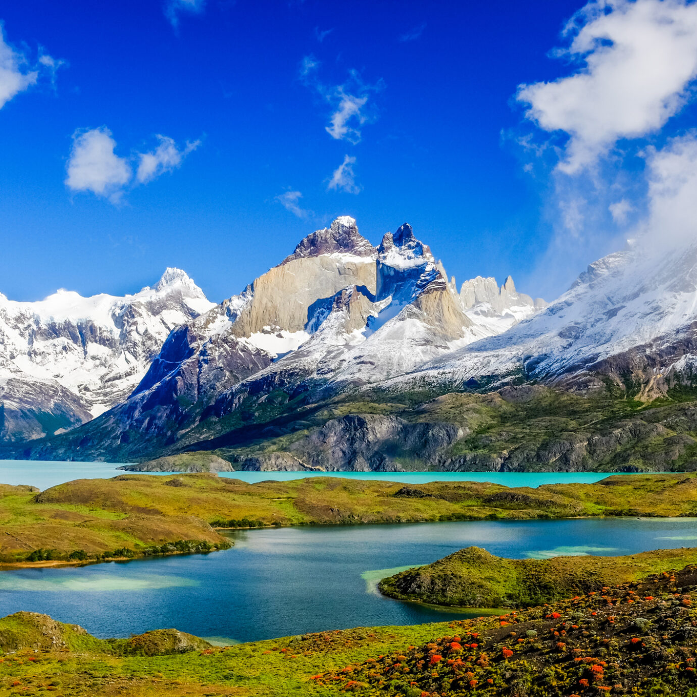 Beautiful Patagonia landscape of Andes mountain range, winding road and lake at Torres del Paine National Park, Chile.