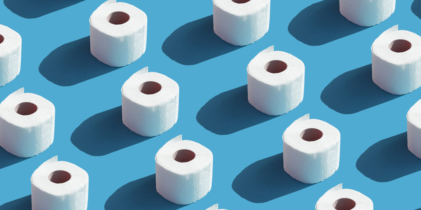 White roll toilet paper on the blue background